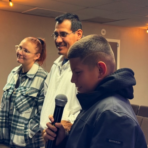 Families welcoming visitors to 360 Church